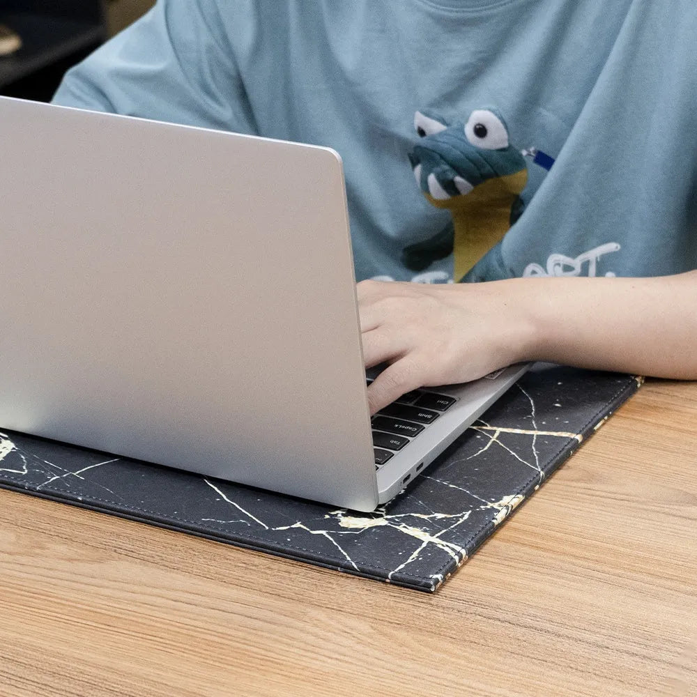 Silicone printing tablet pad in four colours on a desk with a tablet