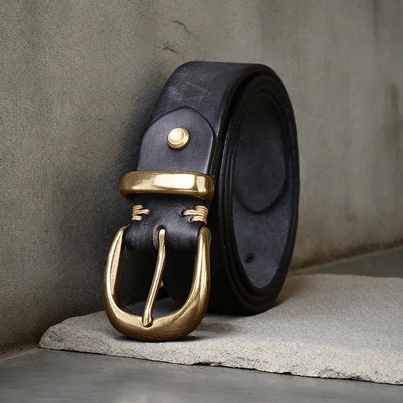 Men's brown casual leather belt with a copper pin buckle shown on a pair of jeans