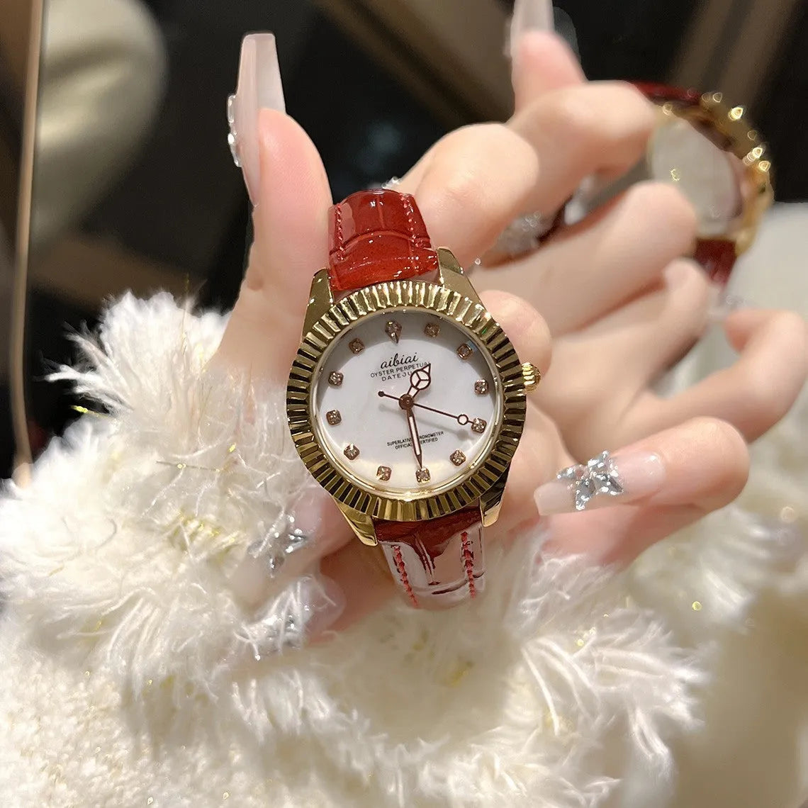 Women's rose shell watch with 7mm thin case, shown with white, red, or black leather strap or steel belt