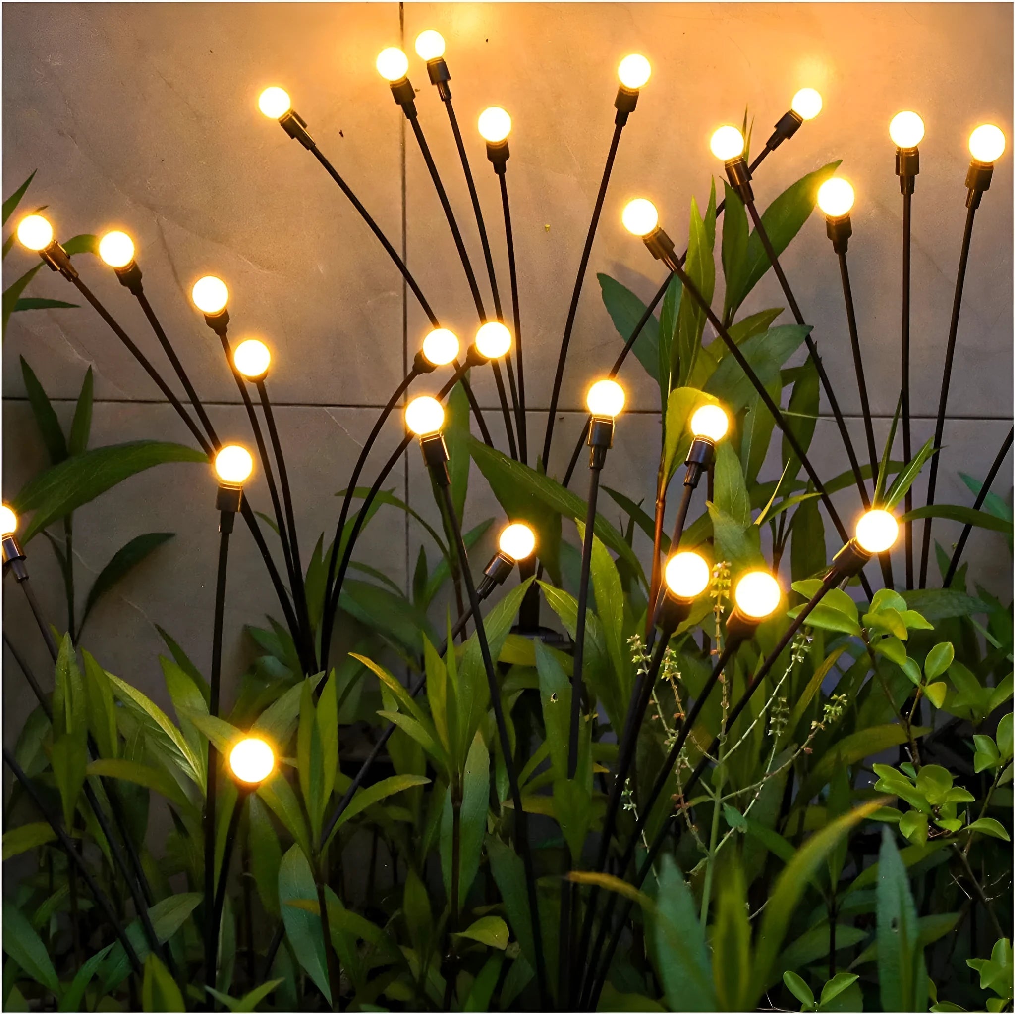 Solar-powered LED firefly garden spike light with multiple heads and a press-in ground plug on grass.