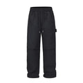 Black paratrooper pants with baggy fit and drawstring waist adjustment