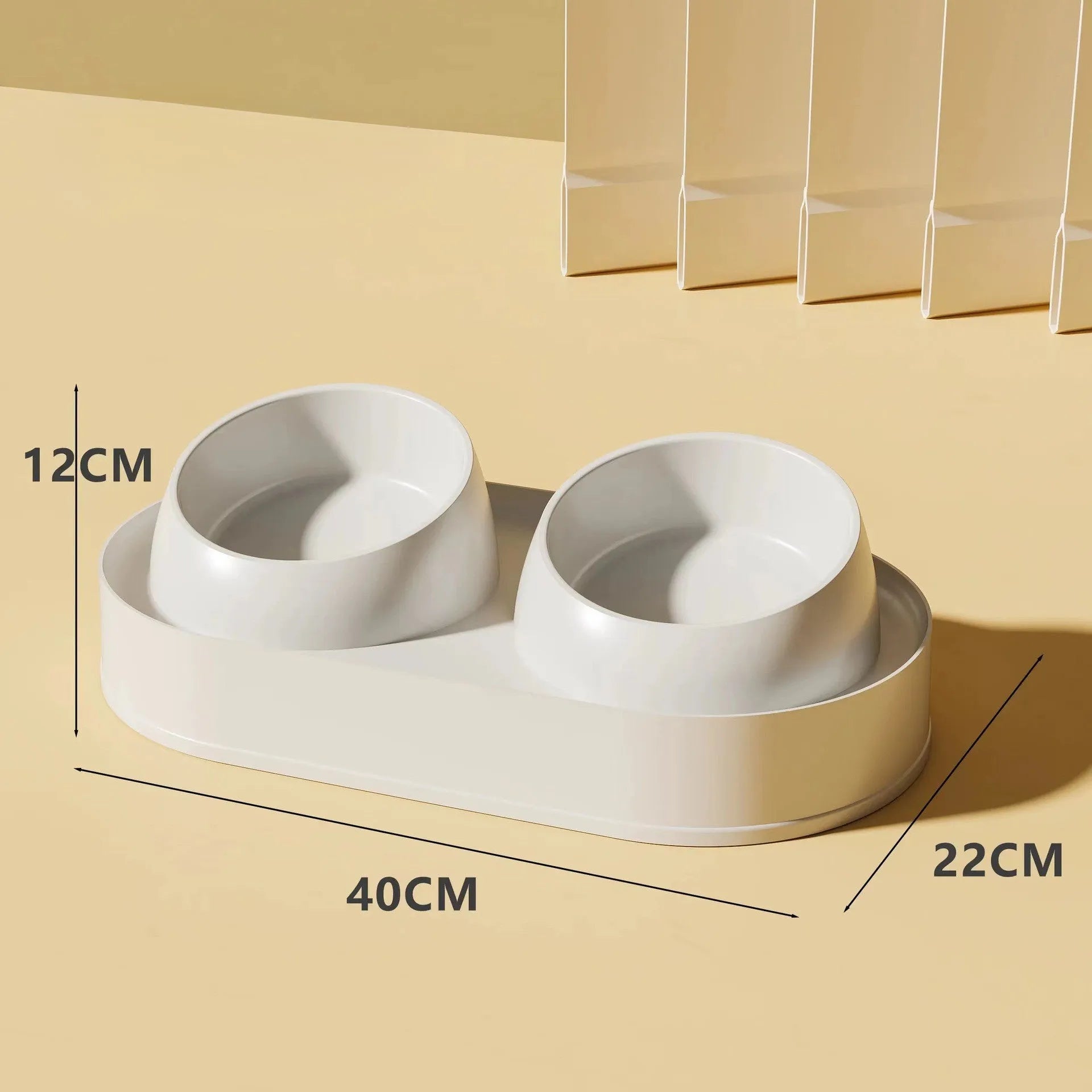 White elevated pet feeder with two tilted bowls on a wide base, for cats and small dogs.