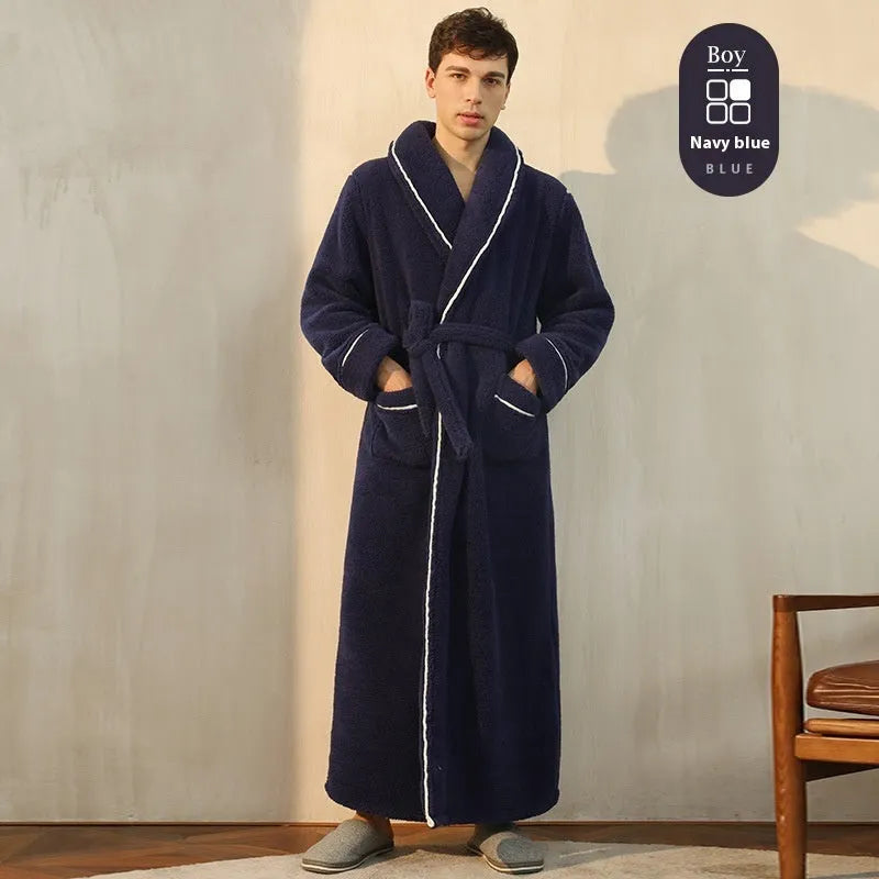 A man and woman wearing matching thick, navy blue flannel bathrobes in a European style cut.