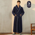 A man and woman wearing matching thick, navy blue flannel bathrobes in a European style cut.
