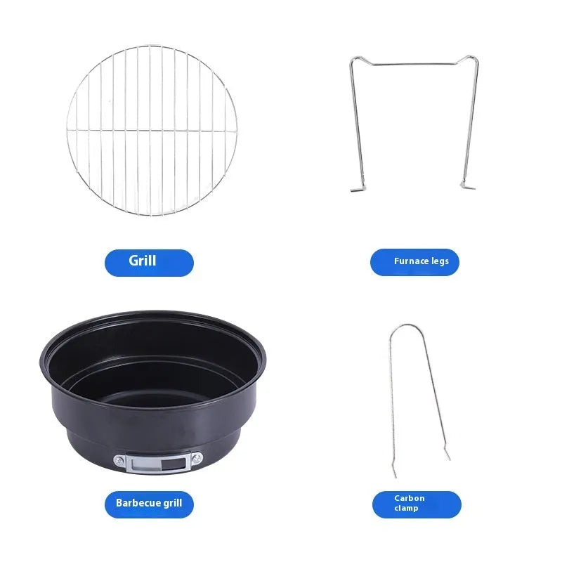 Small round metal folding stove with barbecue grill and mesh, set up for outdoor cooking.