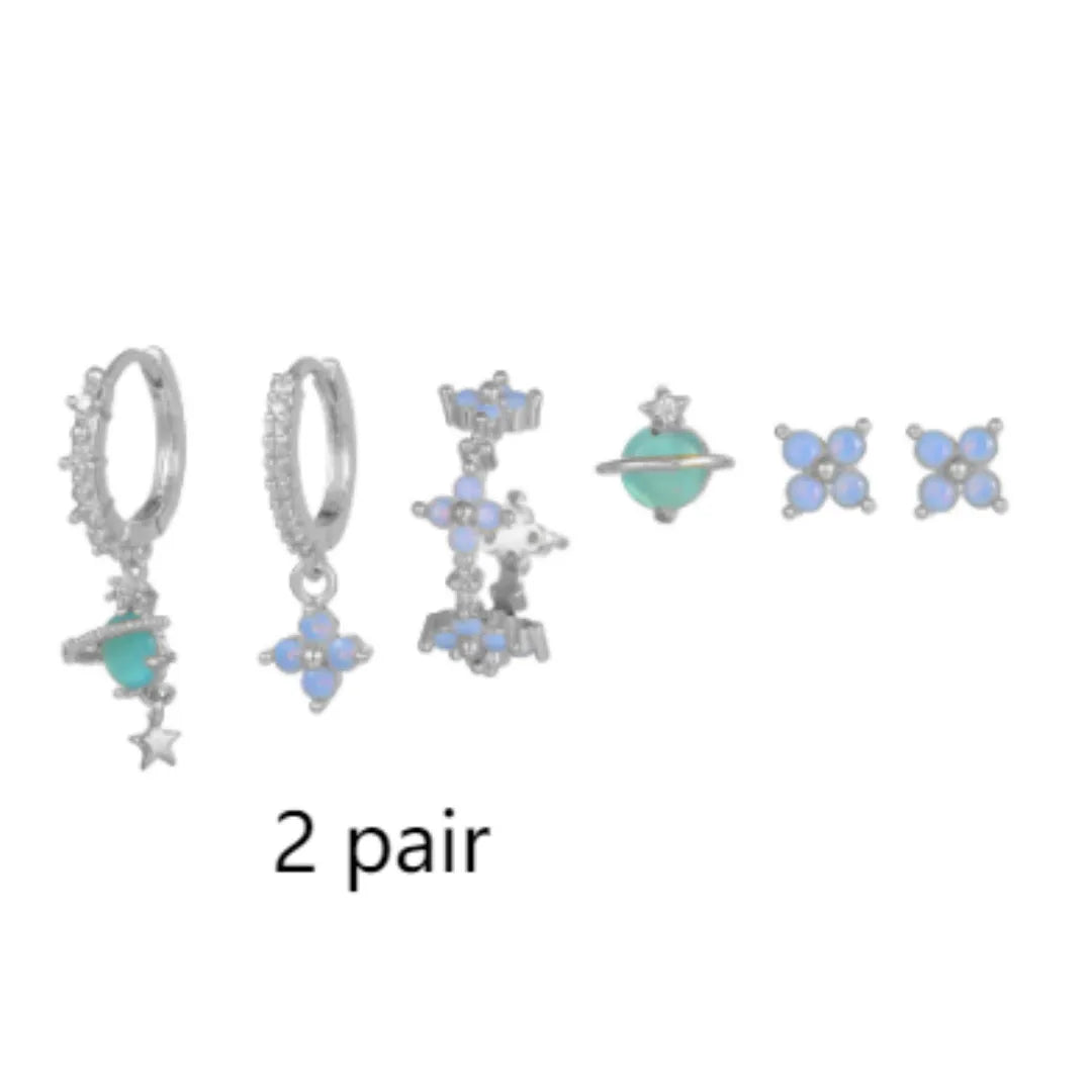 Gold and silver floral ear studs with blue zircon flower nail detail in Japanese Korean style