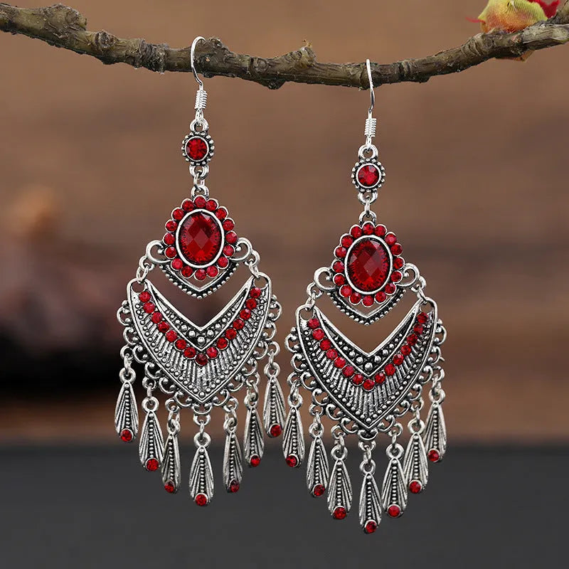 Purple retro drop earrings with long crystal fringe detailing and ethnic styling elements