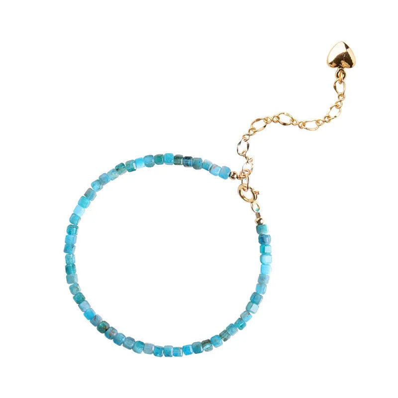 Women's blue apatite crystal bracelet with diamond-shaped beads on an elasticated band.