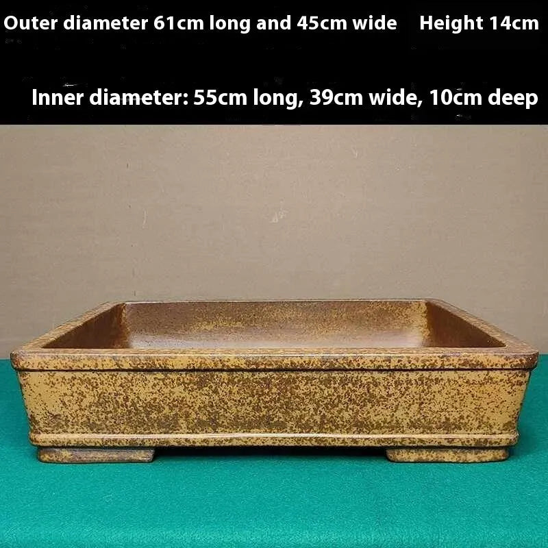 Straight-sided shallow rectangular Yixing zisha clay flowerpot in natural purple colour.