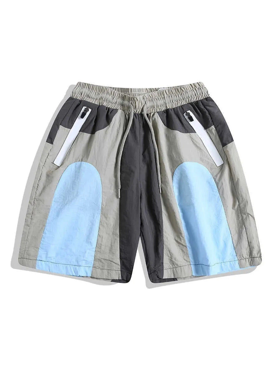 Blue patchwork outdoor sports shorts with loose straight-leg fit and above-the-knee length