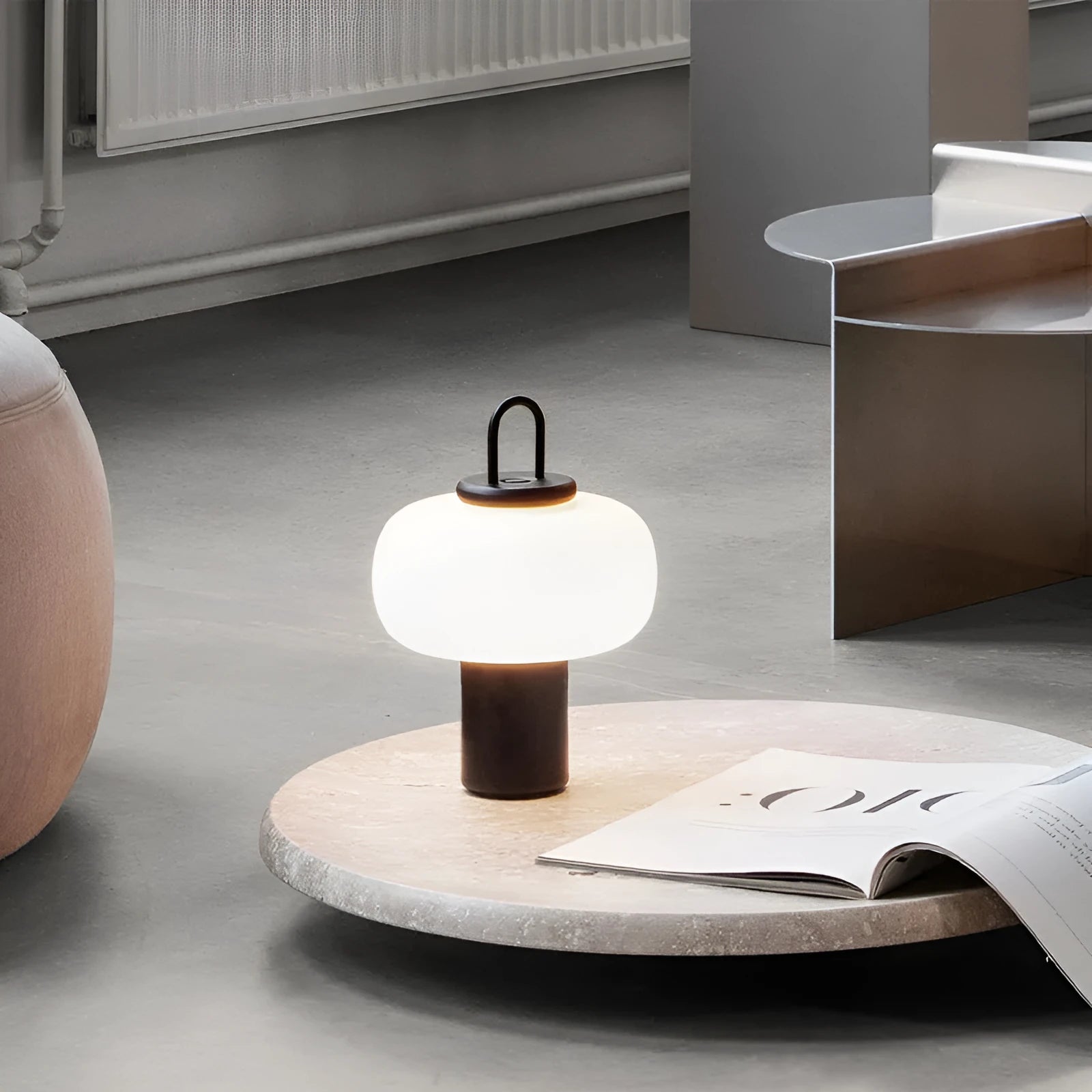 Minimalist Japanese designer glass bedside table lamp with warm light for a child's room.