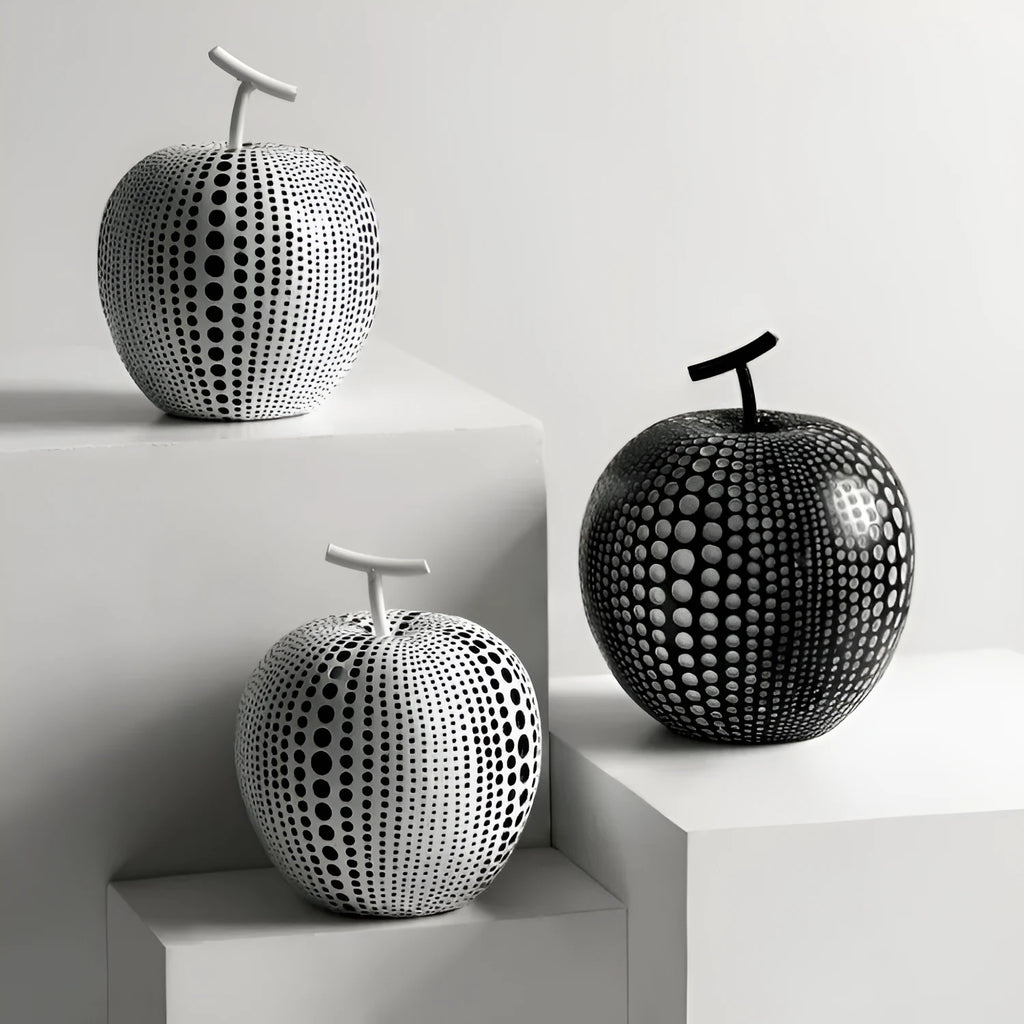 Resin apple and pear ornaments, black high model 17cm by 14cm and white low model 16cm by 12cm.