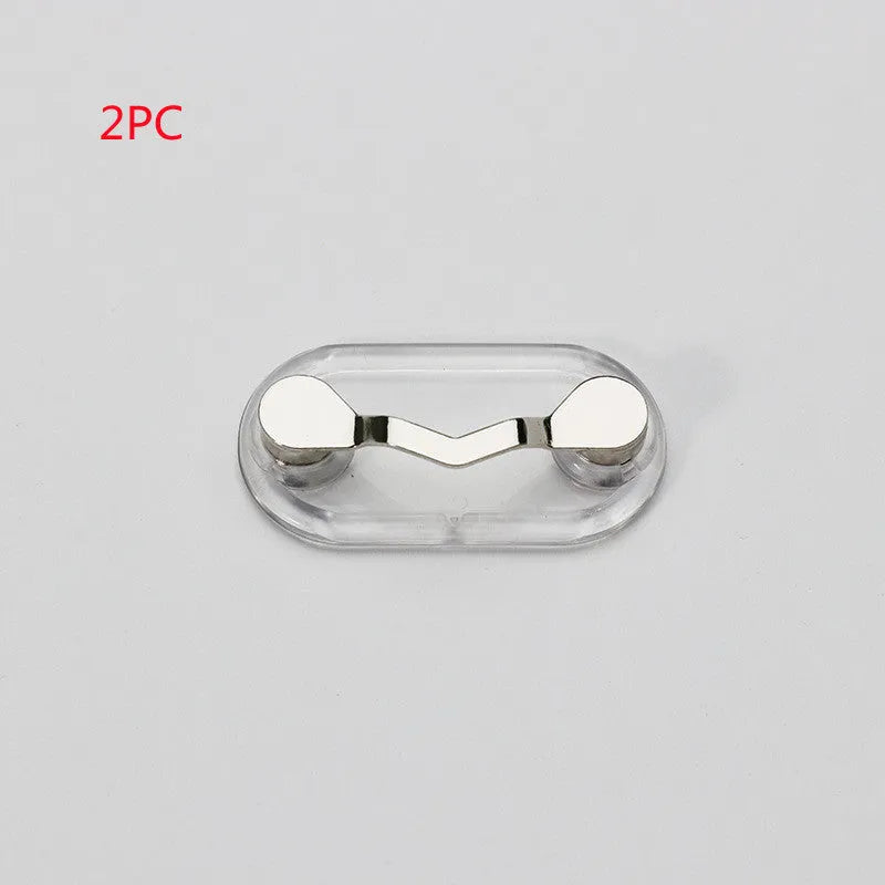 Black magnetic glasses holder on a fridge door with spectacles stored