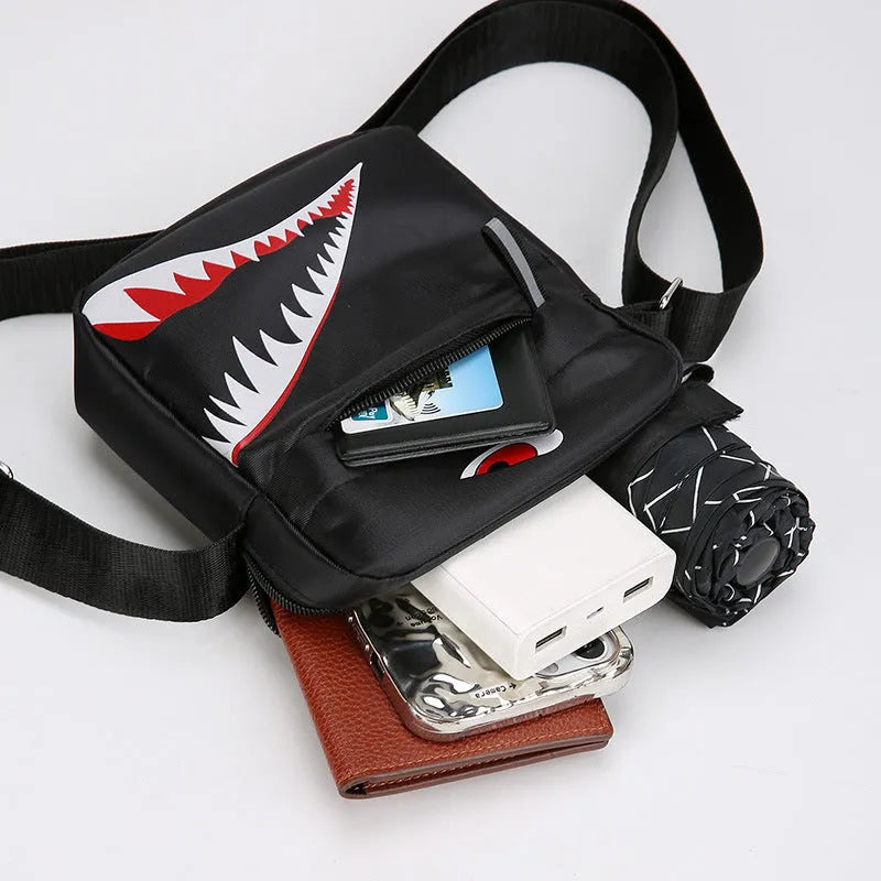 Men's small black Oxford cloth crossbody bag with animal print design and shoulder strap