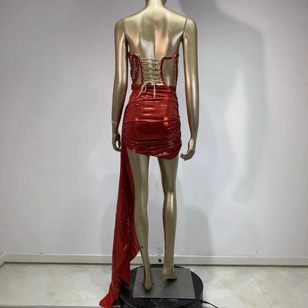 Red women's spandex skirt suit with see-through hollow mesh panels for stage performance.