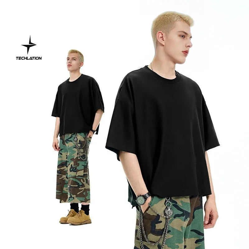 A sand grey men's loose fit short sleeve pullover made from a cotton and polyester blend fabric.