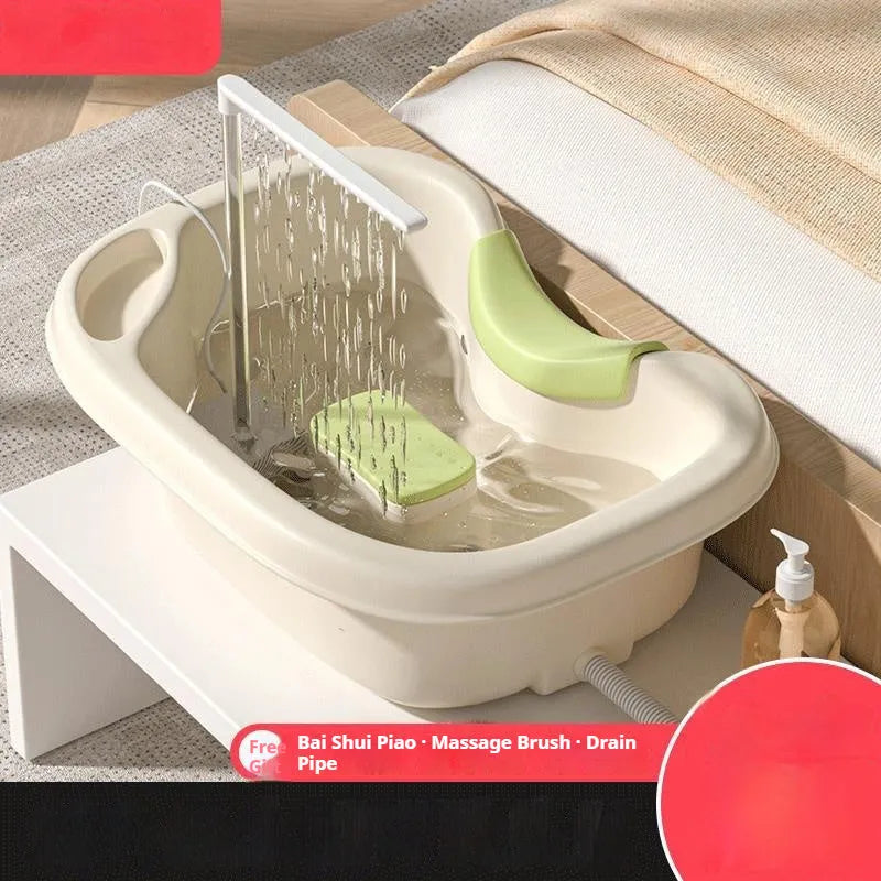 Light pink lying-in-bed shampoo basin with neck pillow and water pump