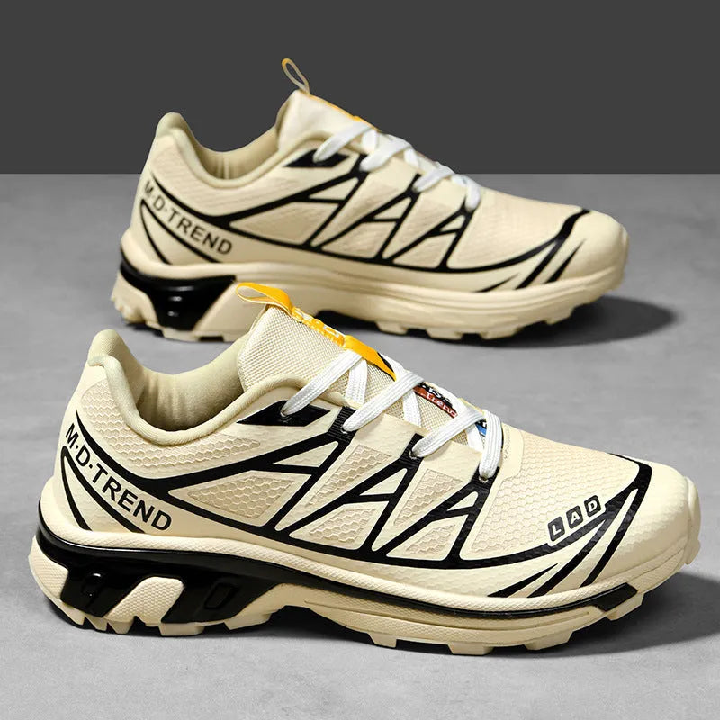 Pair of low-top hiking shoes in artificial leather with a mesh lining and rubber sole.