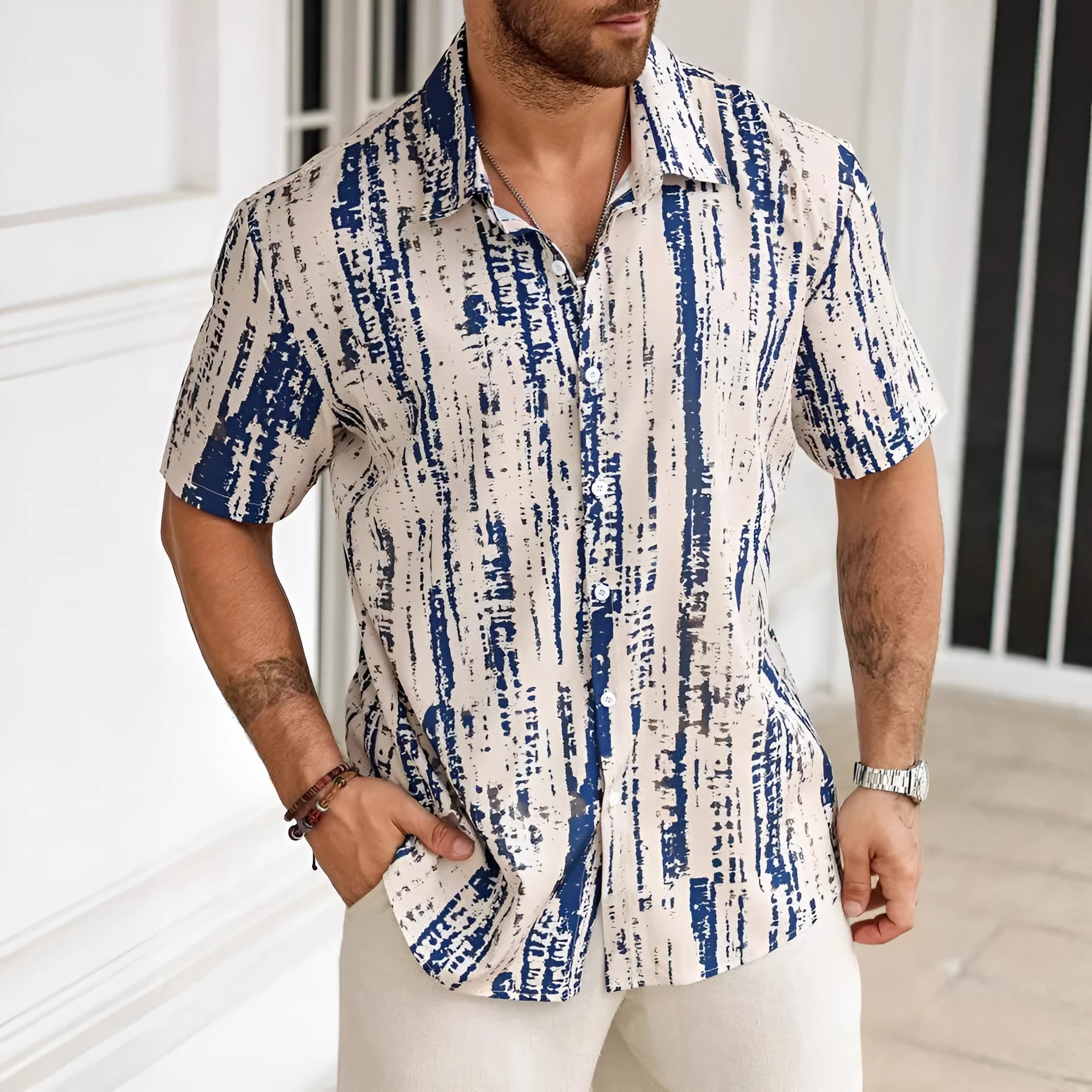 Man wearing a blue striped short sleeve casual polyester shirt.