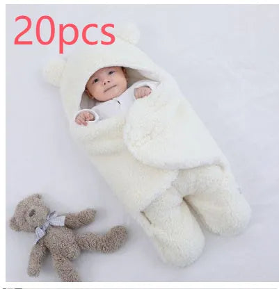 Baby quilted sleeping bag wrapper in cotton blend fabric, shown in a light blue colour.