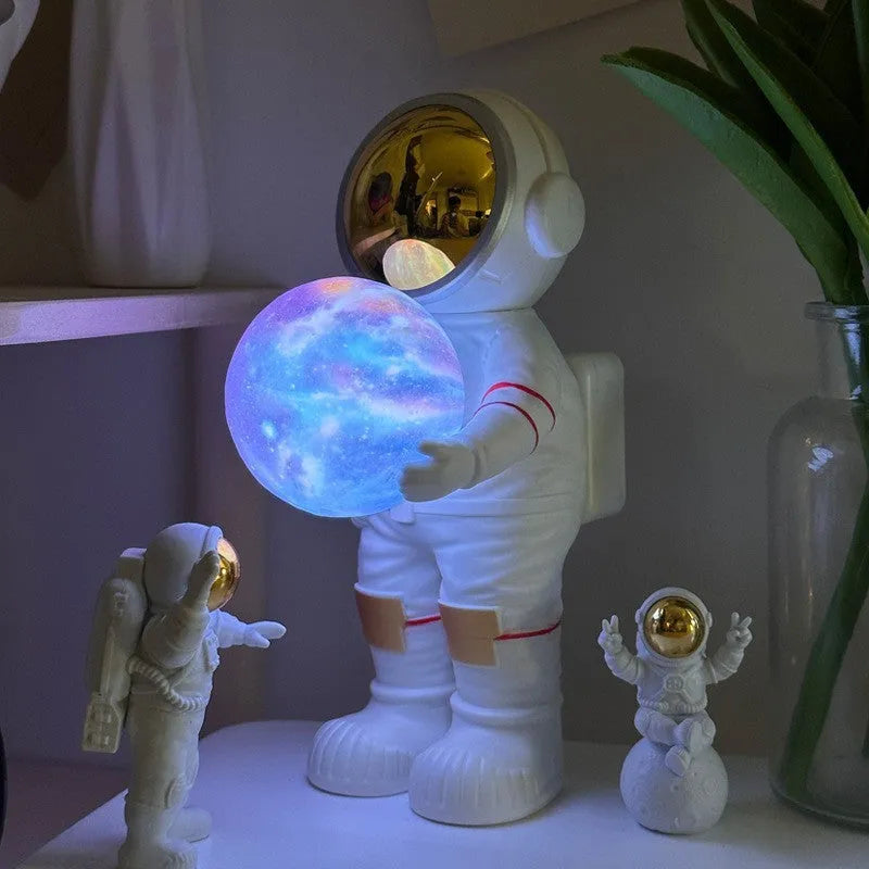 Spaceman starry sky projection lamp on a table, showing star pattern projection