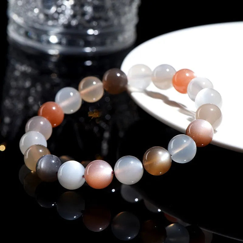 Natural colourful moonlight moonstone bracelet with 8mm beads on a white background.
