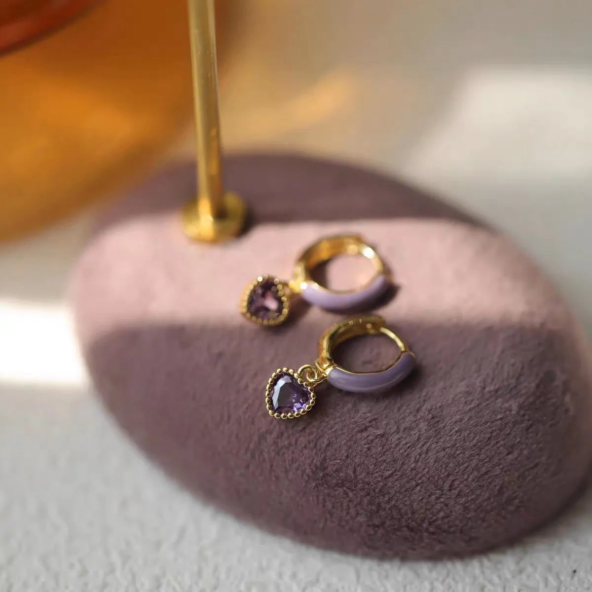 Purple enamel love heart earrings in gold with copper body and geometric bohemian heart design