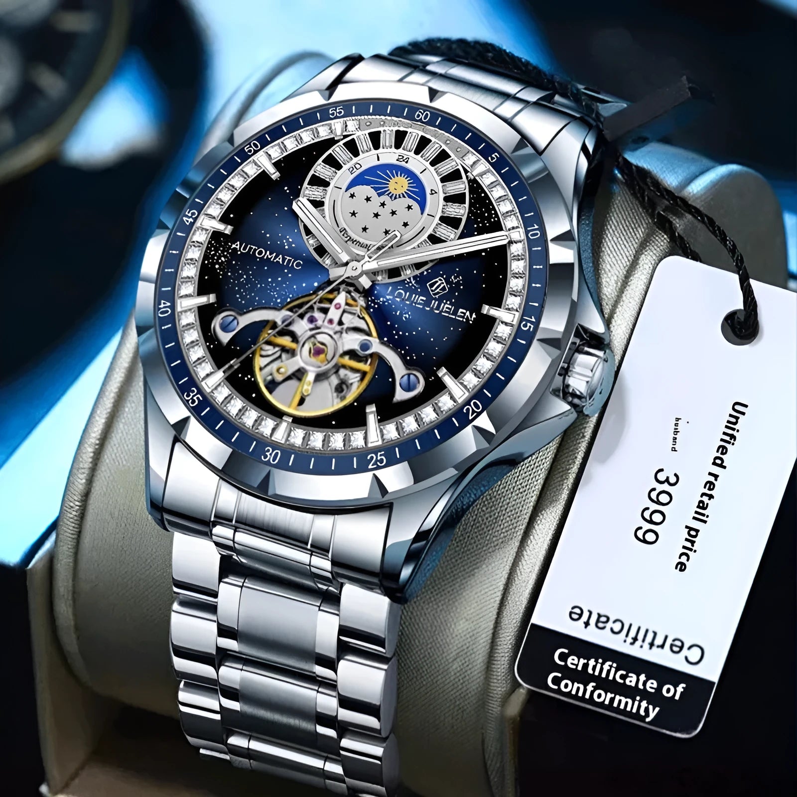 Men's silver automatic watch with blue dial on a stainless steel bracelet, showing transparent case back.