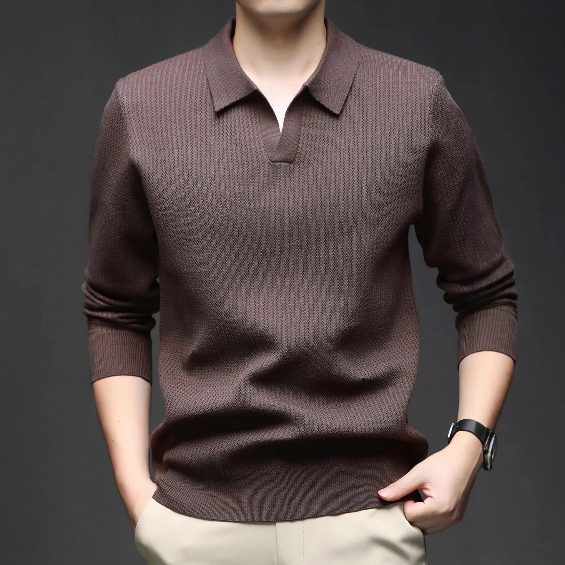 Man wearing a loose fit camel coloured casual pullover sweater.