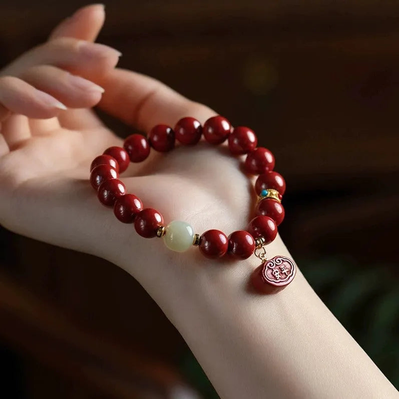 Natural cinnabar Emperor sandstone bracelet with traditional Ping An Fu Lu motifs