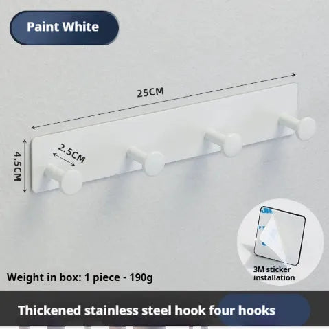 Black screwless adhesive wall hook with three hooks mounted on a glass shower door