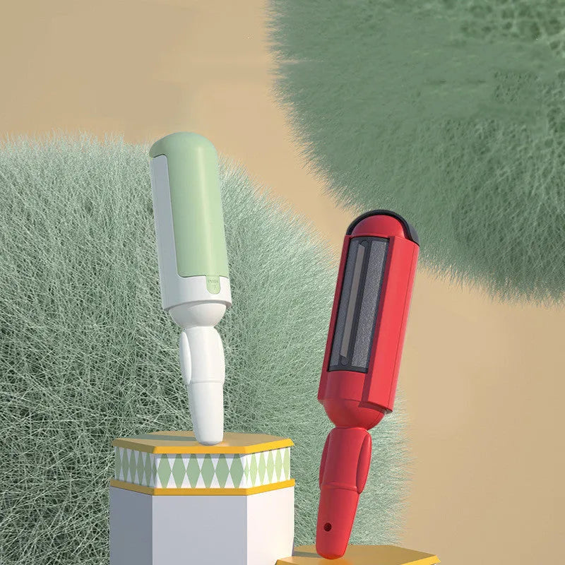 White green reusable pet hair remover roller with non-slip handle on a carpet.
