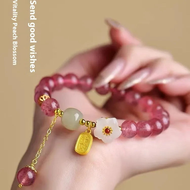 Handmade women's bracelet with Hetian jade and strawberry quartz crystals in peach blossom design