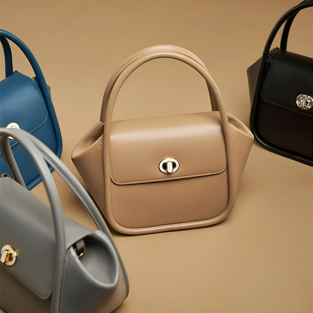 Women's cow leather wing handbag with cross-body strap and hand handles in black colour option