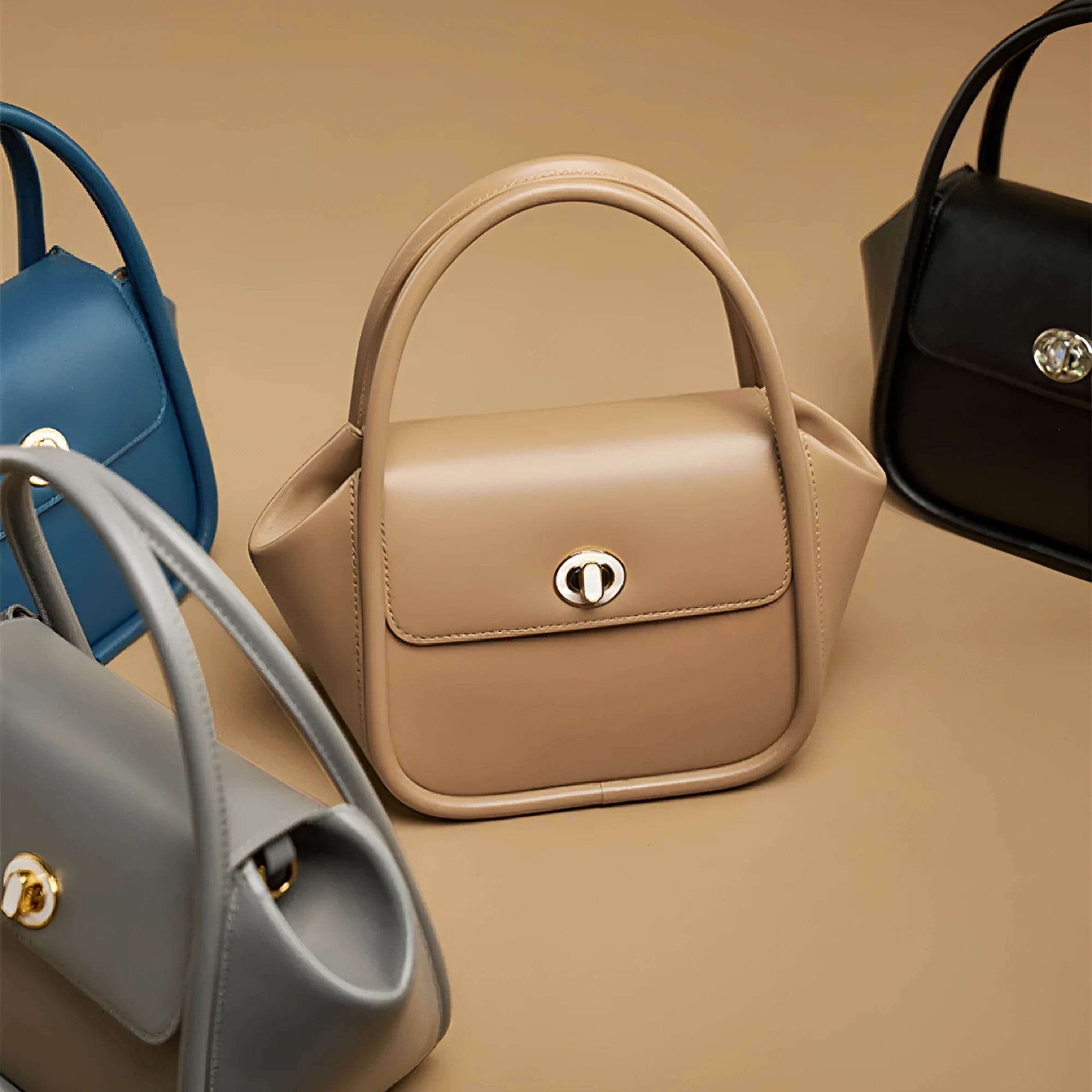 Women's cow leather wing handbag with cross-body strap and hand handles in black colour option