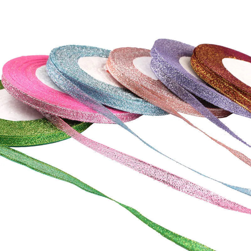 Roll of narrow 0.6cm wide polyester gift ribbon in a multicolour pattern.