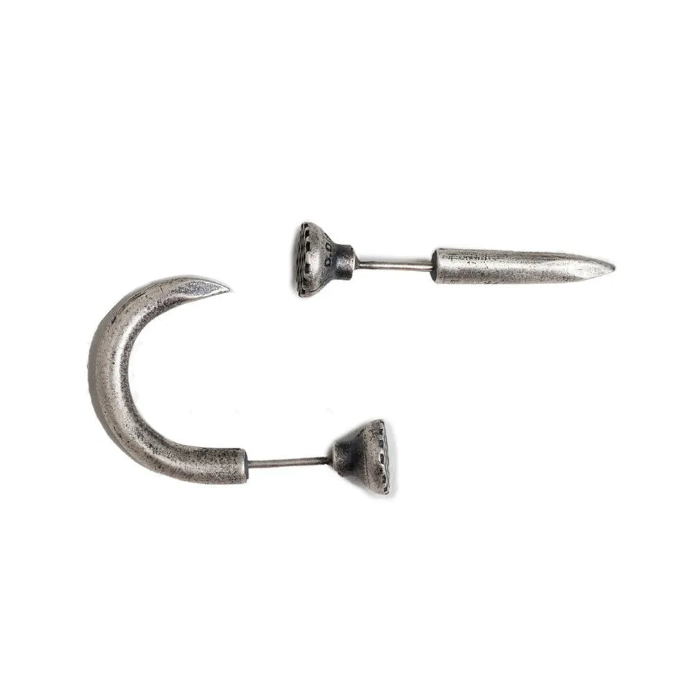 S925 sterling silver nail stud earrings in straight and curved punk designs on a plain background.