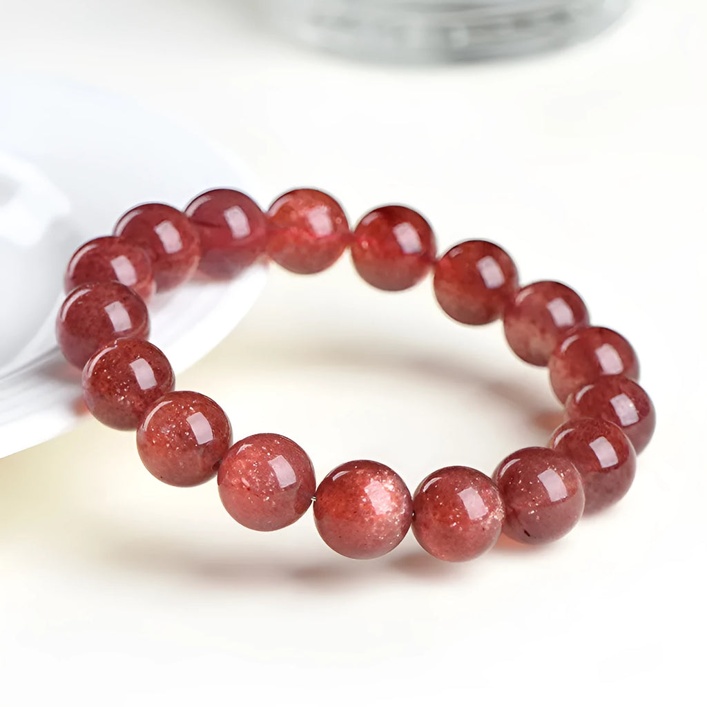 Natural cherry red strawberry quartz bracelet with geometric beads showing starlight effect