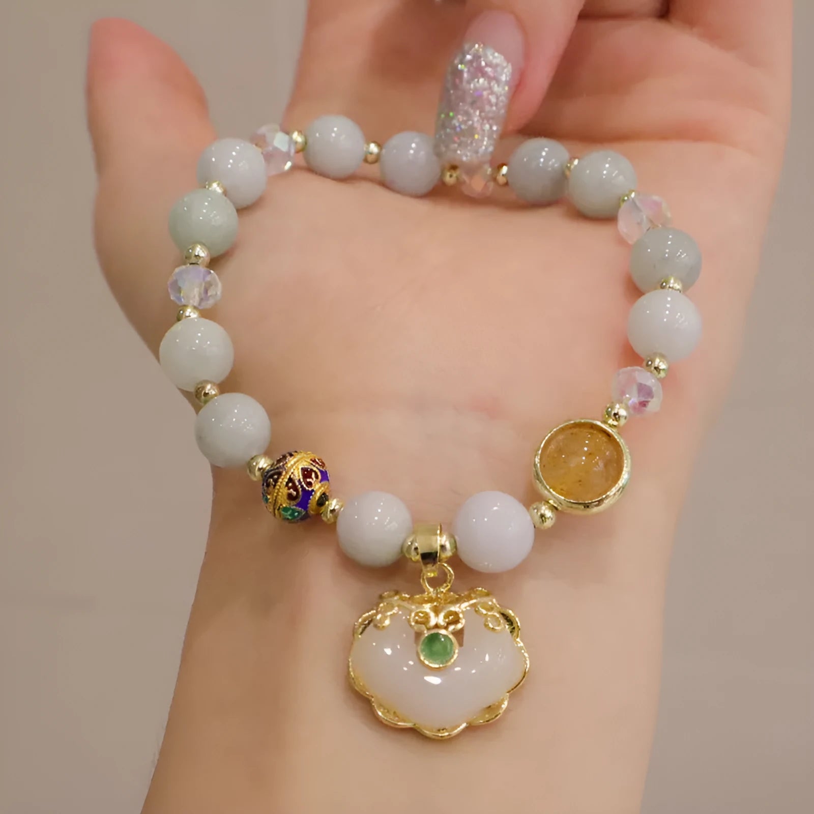 Women's geometric bracelet with strawberry quartz or gray jade stones and ethnic metal decorations