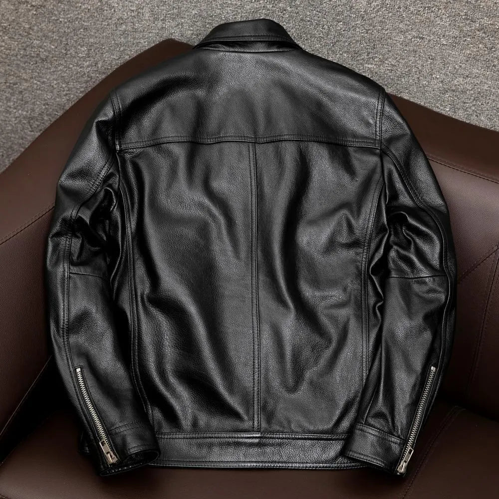 A man's black plus size PU leather jacket with a lapel and side pockets, shown on a hanger.