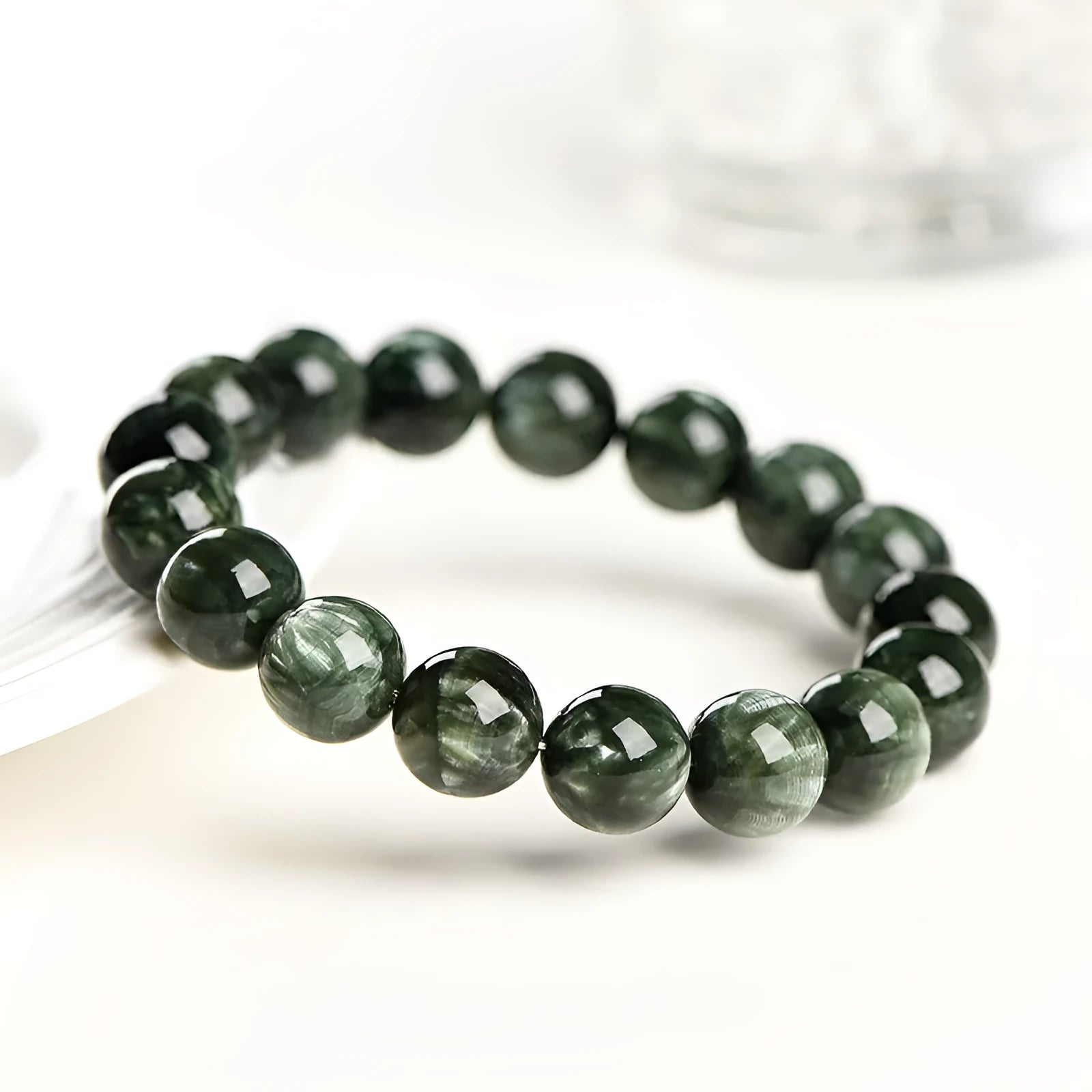 Natural Green Dragon Crystal round bead bracelet with 8-9mm beads and a Ruyi charm.