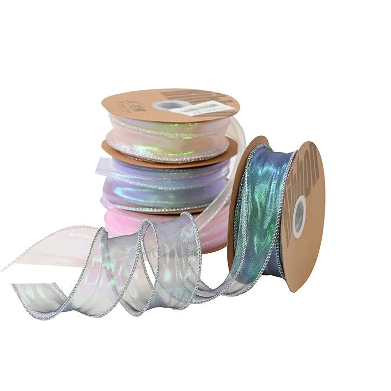 Roll of 4cm wide colourful mesh ribbon with fishtail yarn floral wave design.