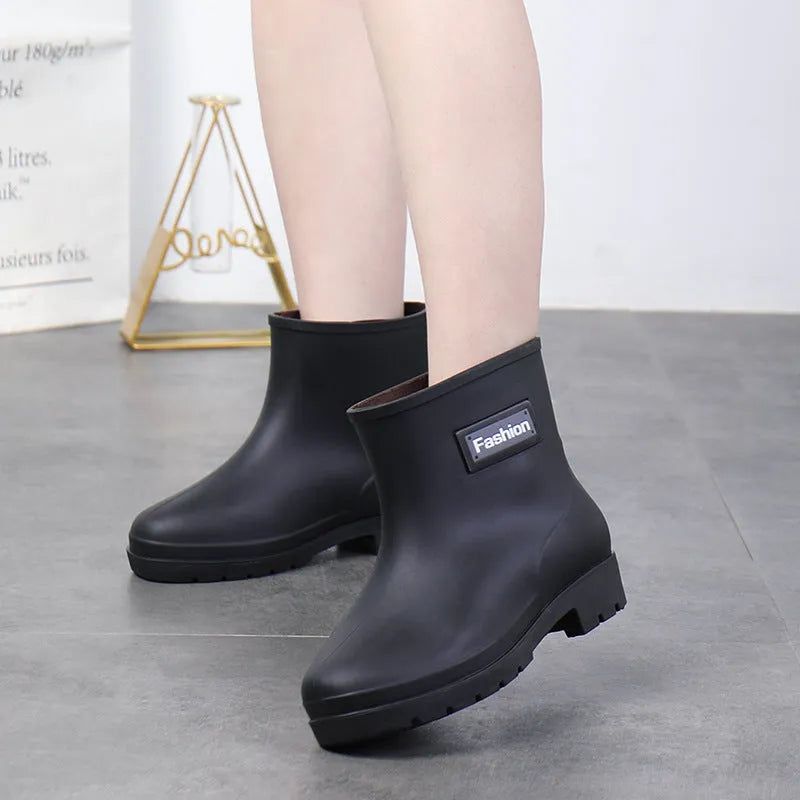 Women's mid-calf rain boots in PVC material with low heel for waterproof work wear