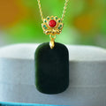 Flat polished Hetian Grey Jade pendant with copper inlay and Ink Blue Jade accents on a necklace.