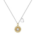 Close-up of a geometric sunflower pendant necklace on an adjustable silver cross chain.