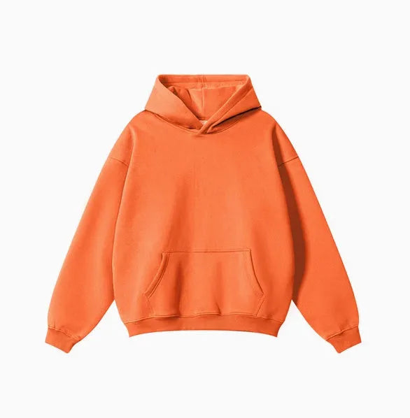 A loose-fitting men's cotton hooded sweater in a pullover style on a hanger.