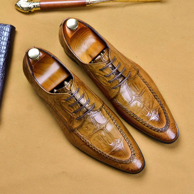Men's brown leather loafers with a shiny horsebit buckle detail on the front, shown on a foot.
