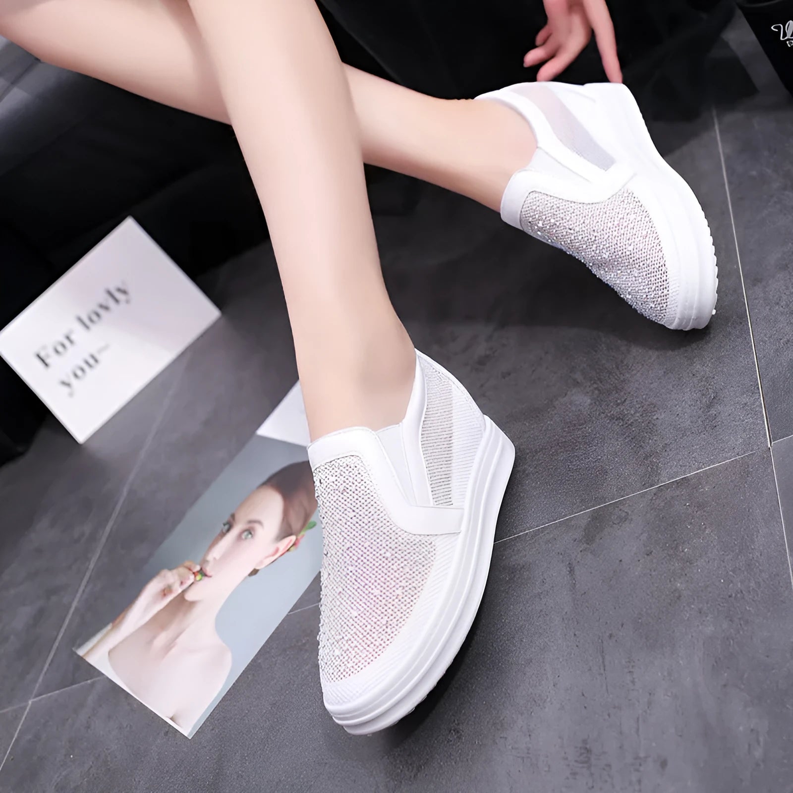 Women's wedge slip-on shoes with mesh upper in black colour showing rubber sole