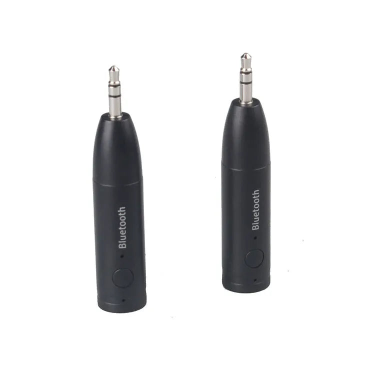 Black Bluetooth 5.0 audio receiver for car AUX or home stereo, shown with USB cable.