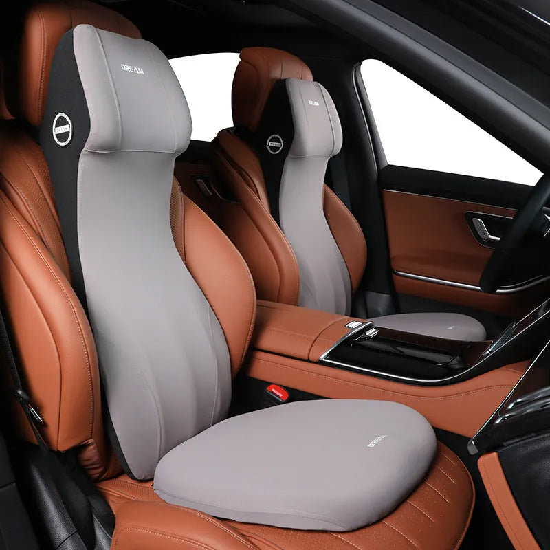 Black automotive memory foam mat showing integrated waist cushion and headrest lumbar support pillow on a car seat.